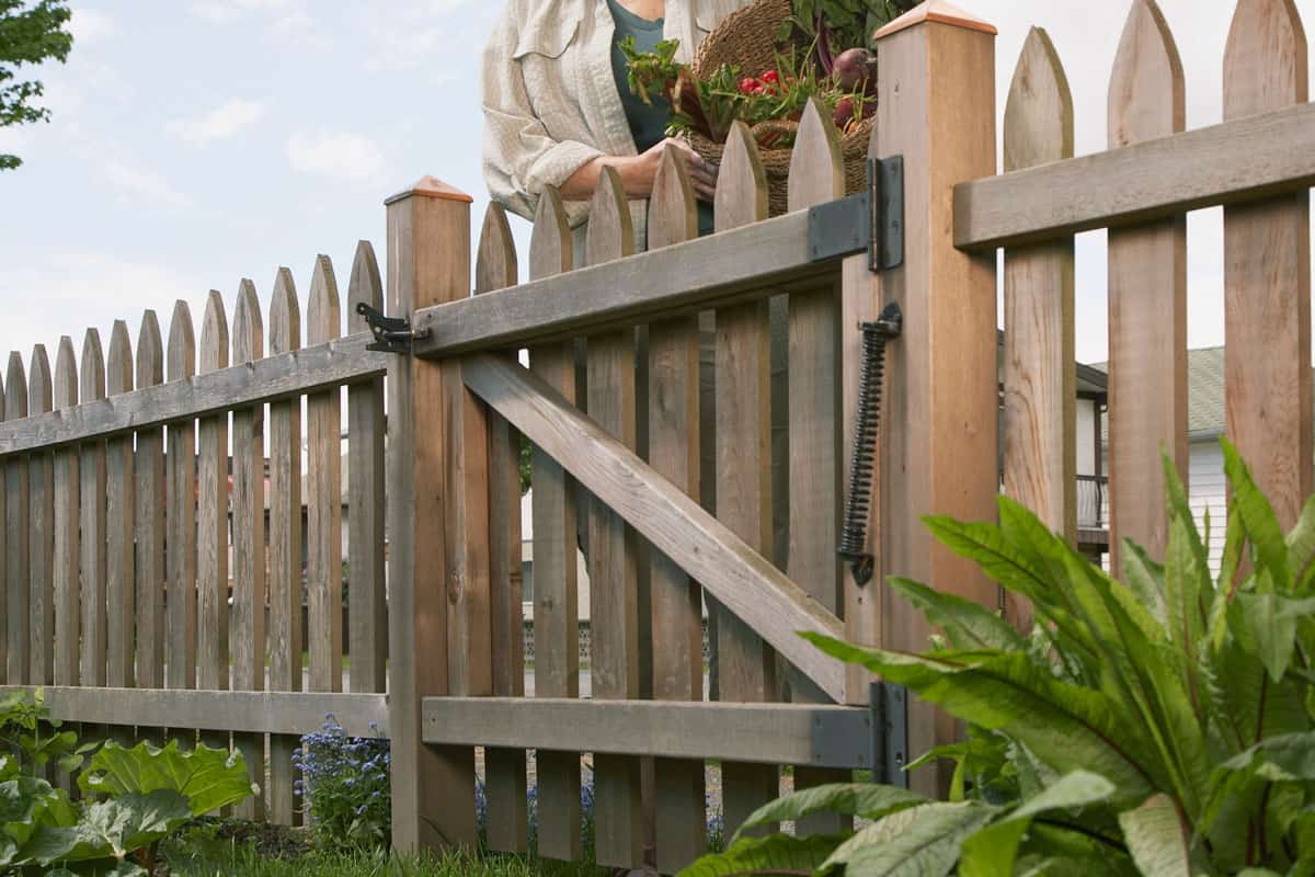 Wood fence gate with neighboor on front