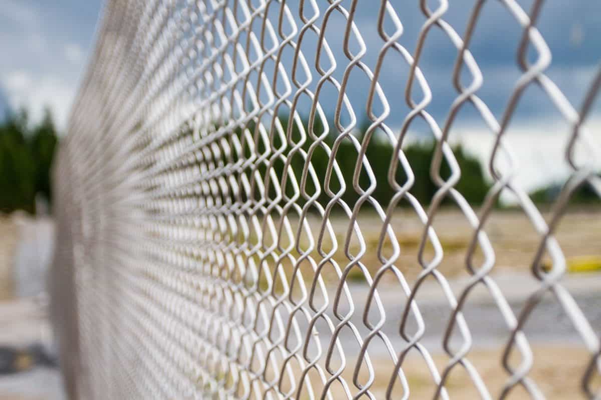 A long chain link fence for a private land area