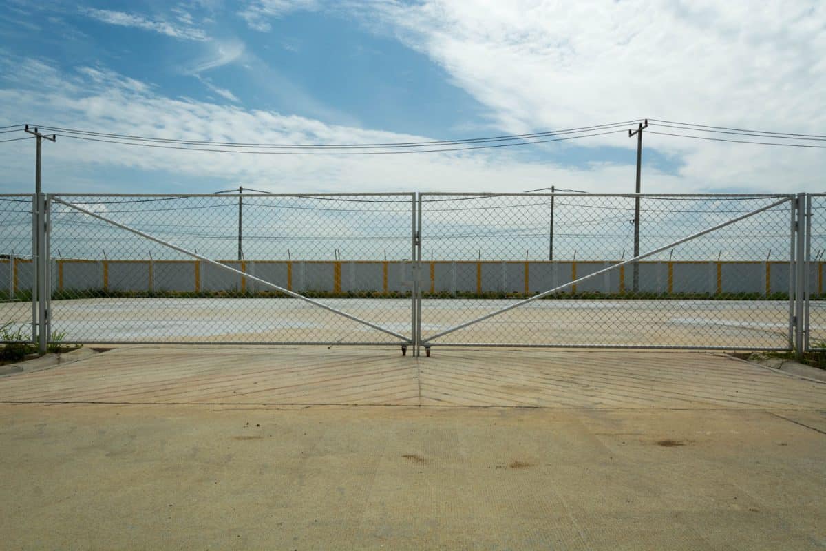 A long chain link gate for a secured private area