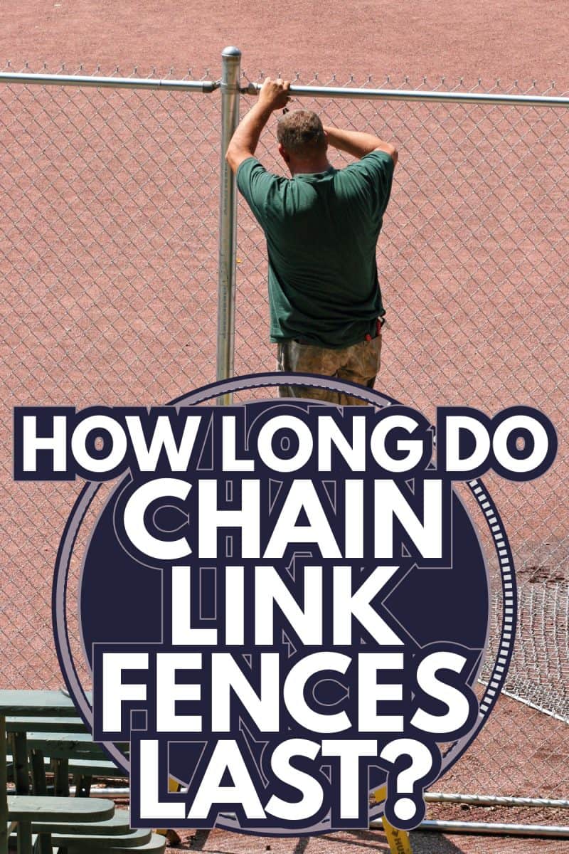 A man erecting a chain link fence in a park. How Long Do Chain Link Fences Last