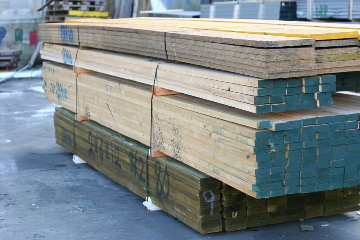 A small stockpile of pressure treated wood