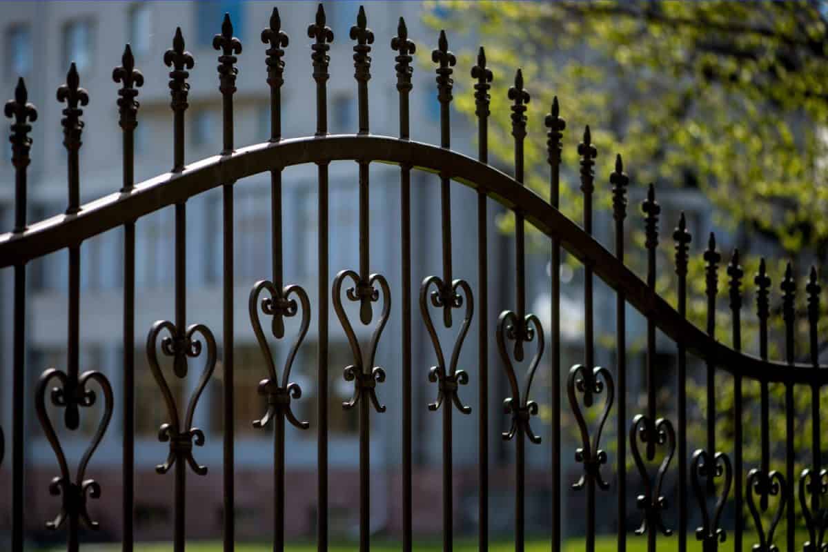 Black painted wrought iron fences for a private area