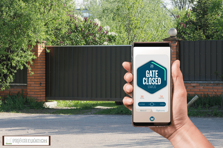 A long black sliding metal gate for a private high end property, Can I Open My Gate With A Smartphone? [And How To]