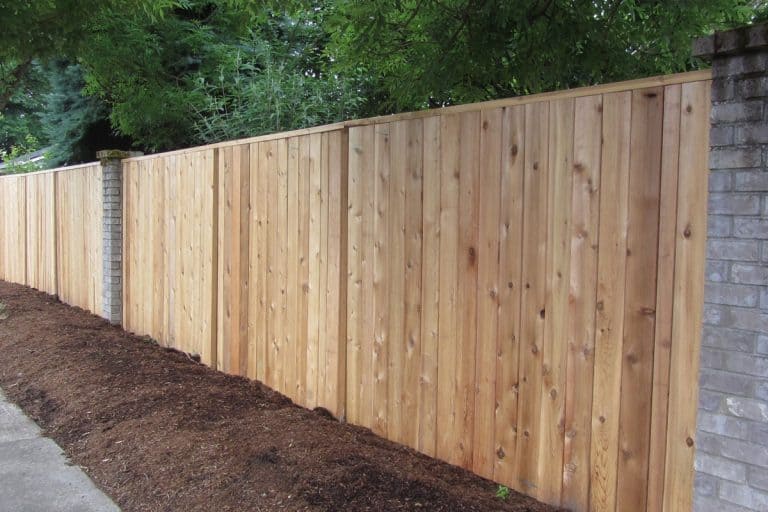 Cedar Fence with Brick accents, privacy fence, What Are The Best Nails For Cedar Fence?