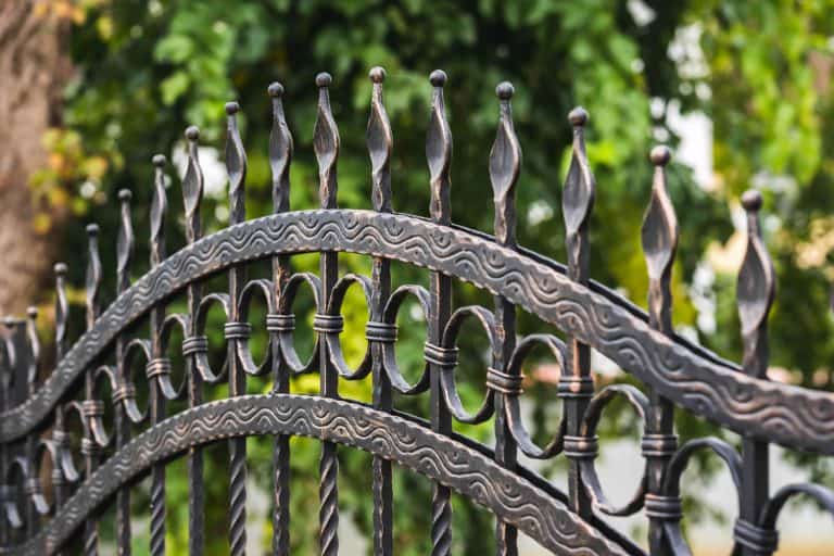 Classic mid century inspired wrought iron fence, Do Wrought Iron Fences Rust? [And How To Prevent That]