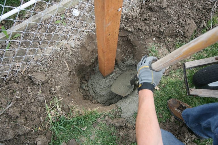 Dig a deep hole in the soil to pour mortar on the fence posts to strengthen the foundation - Should Fence Posts Be Below Frost Line? [How To Prevent Frost Heave Posts]