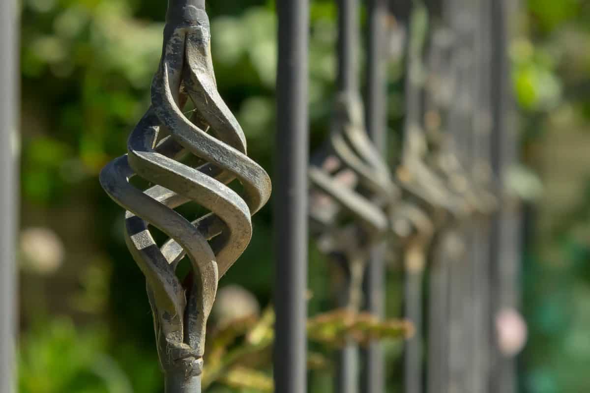 Wrought iron fence with a twisted design