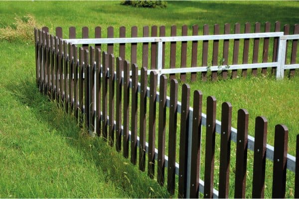 low fence, as protection against dogs. protects the playground from uninvited guests.