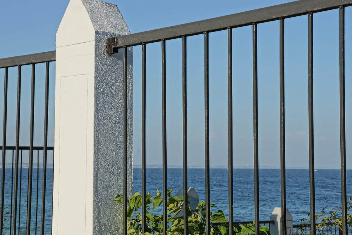 Metal fence with a view overlooking the beach