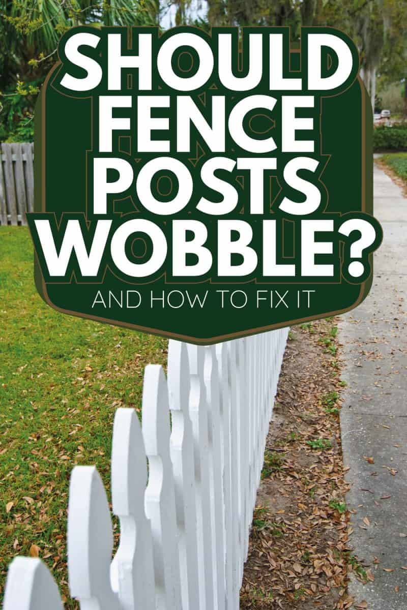 white picket fences in front of the lawn of a suburban house. Should Fence Posts Wobble [And How To Fix It]