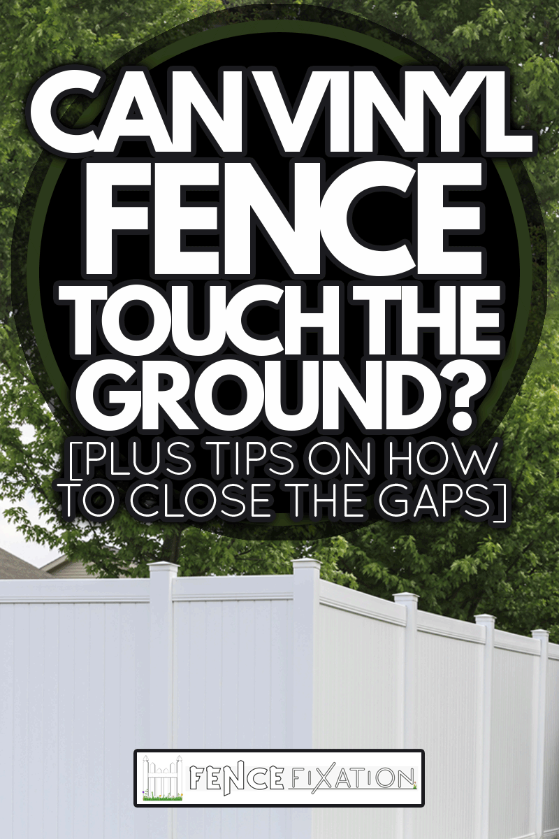 A white vinyl fence running across a yard on spring day with blue sky and trees in the background, Can Vinyl Fence Touch The Ground? [Plus Tips On How To Close The Gap]