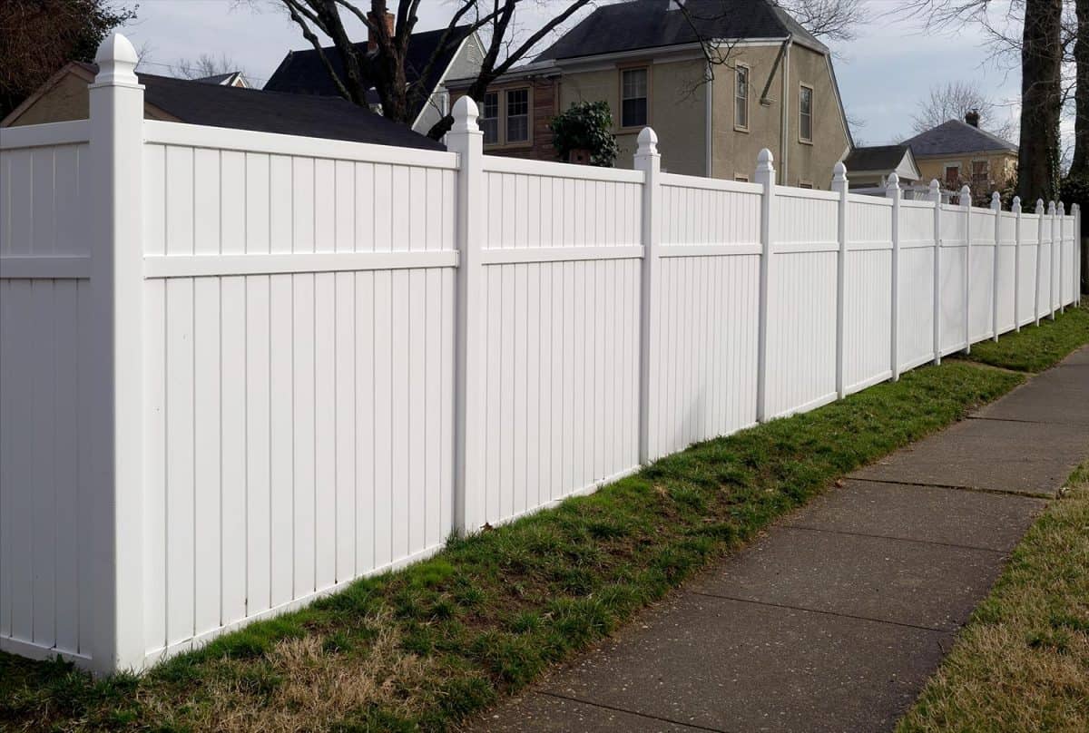 White vinyl fence in residential neighborhood